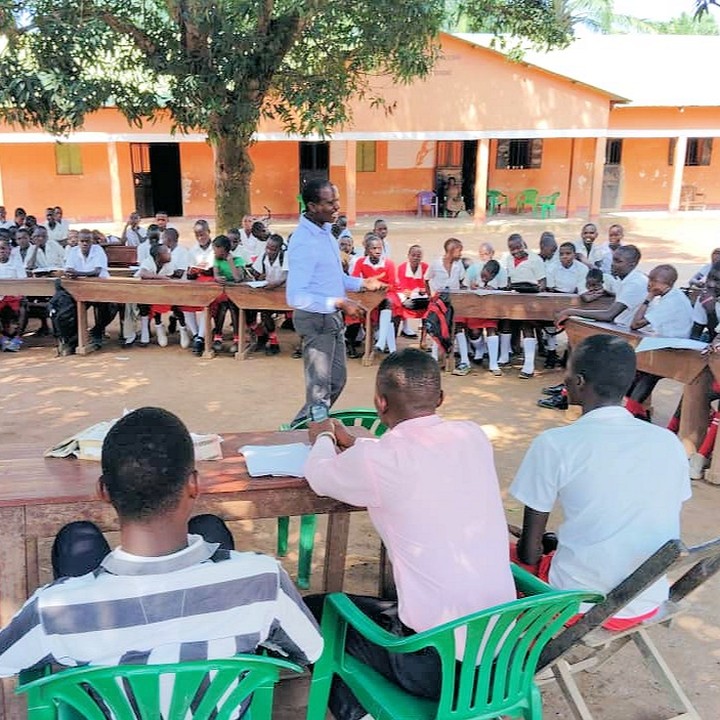 2024 photos from St Timothy's School, Nzara, South Sudan. Including photos of the students' outdoor debate about the relative merits of girls' versus boys' education. They decided that education of girls was the most important!