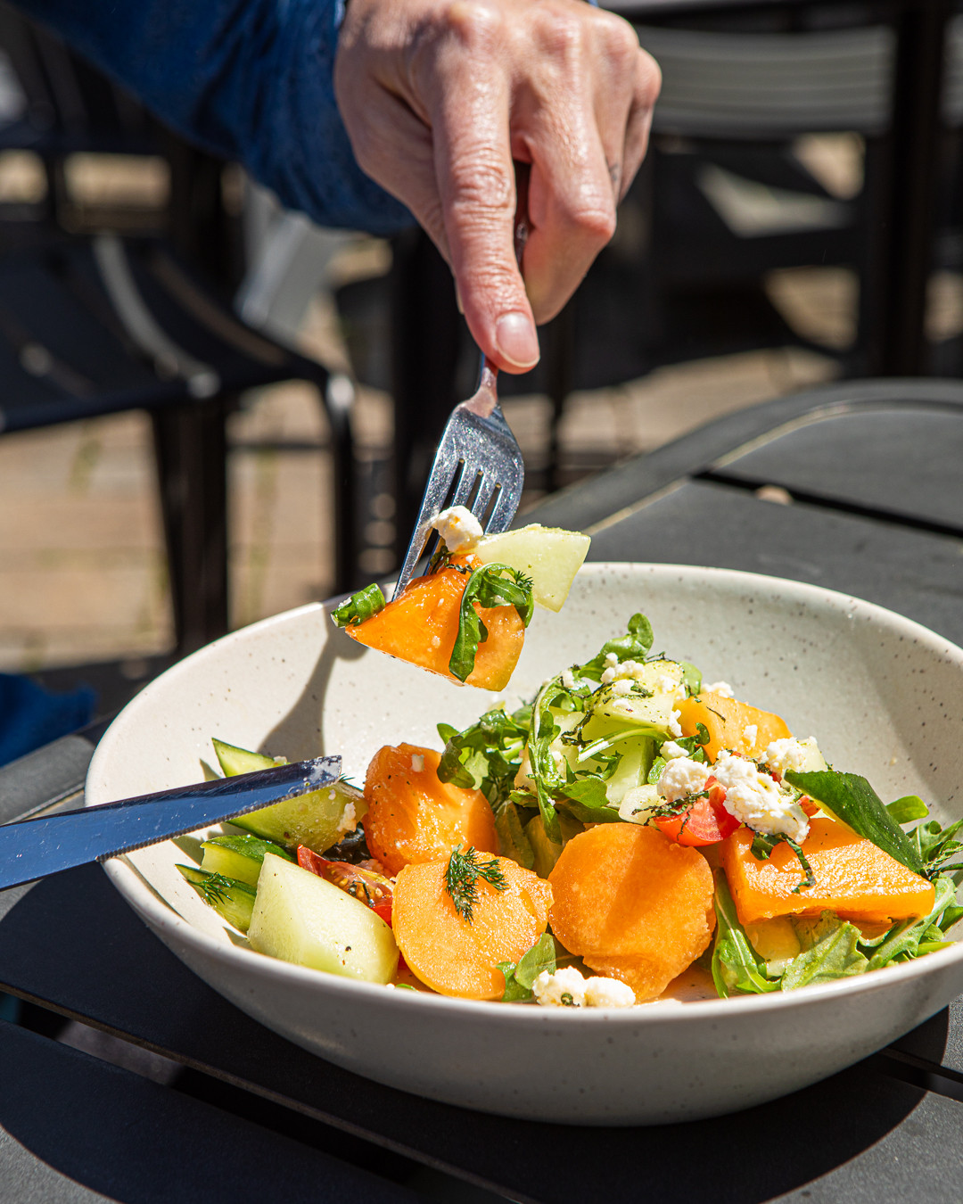 Sunshine in a bowl. ☀️ Melon & Arugula Salad with heirloom tomatoes, cucumber, spearmint, sheep's milk feta and honey vinaigrette!
